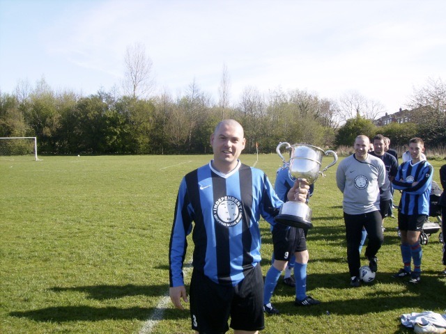 IAN KENNY WITH THE SECOND DIVISION WINNERS TROPHY