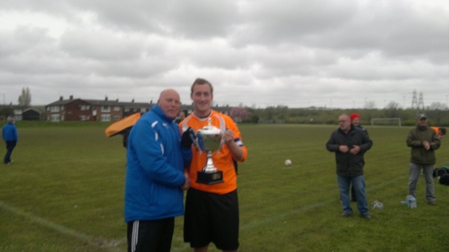 AFC Wearside captain James Gollagy  recieving 3rd Division winners Trophy