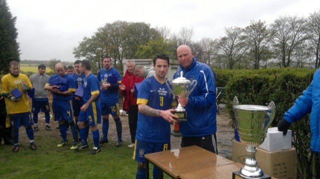 Farringdon SC captain Micheal Noble recieving League Cup Runners up Trophy