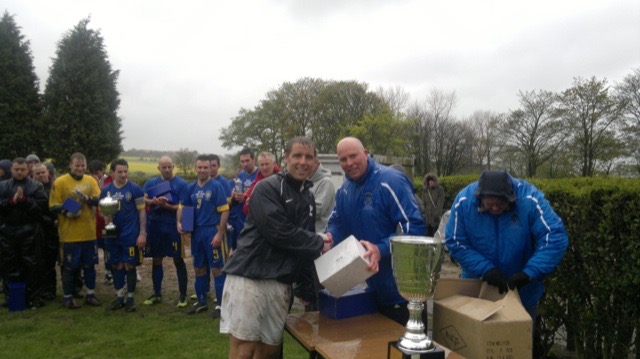 John Butler of Humbledon PF recieving League Cup Man of the Match Trophy