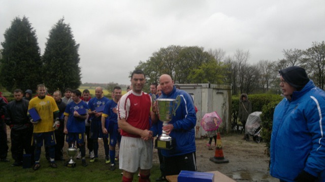 Captain  of Humbledon Plains Farm Paul Wardle recieving League winners Cup
